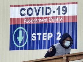 People enter a COVID-19 Assessment Centre in Scarborough, Ont.