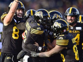 Hamilton Tiger-Cats quarterback David Watford (6) celebrates his touchdown with teammates during second half CFL East Final football action against the Edmonton Eskimos in Hamilton, Ont., on Sunday, Nov. 17, 2019.