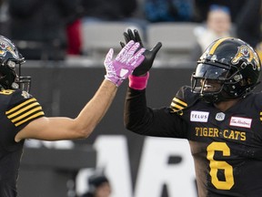 Hamilton Tiger Cats quarterback David Watford celebrates a touchdown with teammate Jaelon Acklin in this photo from Oct. 19, 2019.