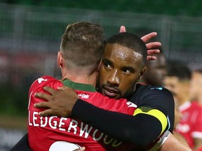 Cavalry FC's Nik Ledgerwood congratulates Pacific FC counterpart Jamar Dixon after Wednesday night's Canadian Championship quarter-final at Spruce Meadows' ATCO Field in Calgary. Pacific FC won the game 1-0.