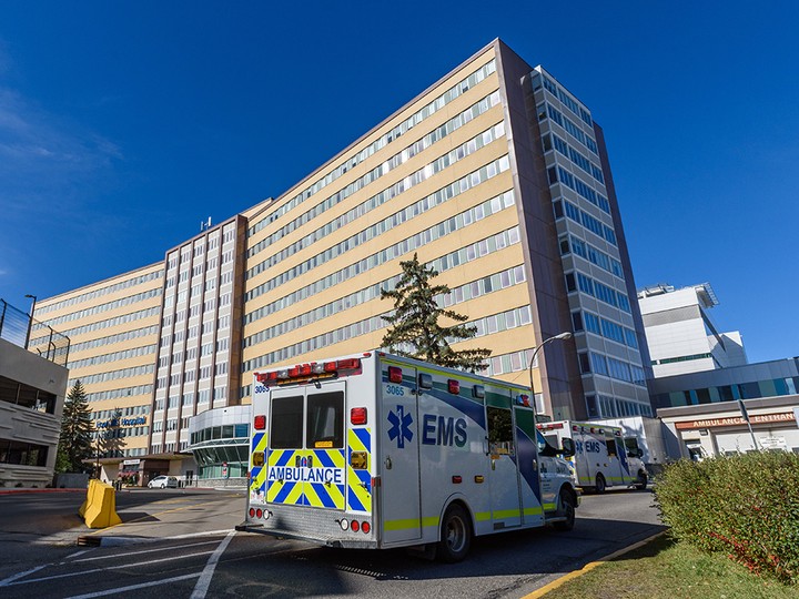  An ambulance proceeds to the emergency entrance of Foothills Hospital on Sept. 24, 2021.