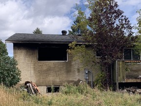 Fire scene from 100 block of Rundlecairn Rd NE. Most of the damage was at the rear of the house.