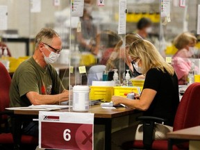 Special ballot officers in Ottawa count mailed-in ballots during the election.