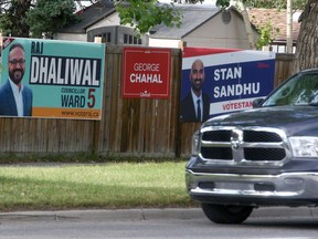 Ward five election signs and federal election signs are seen scattered across Falconridge Blvd. NE. Thursday, September 2, 2021.