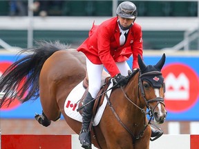 Canada's Eric Lamaze riding Fine Lady 5 during the BMO Nations' Cup at the Spruce Meadows Masters in Calgary on Saturday, September 11, 2021. Al Charest / Postmedia