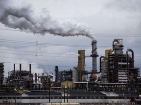 Steam rises from the Syncrude Canada Ltd. facility in the Athabasca oilsands near Fort McMurray, Alberta.