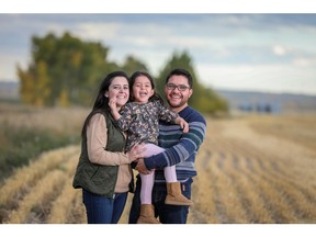 Javier Ricaurte and Maria Isabel Larrea  explore their new community in Rangeview with their daughter Mia Ricaurte, 3.