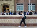 Students exit Western Canada High School at the end of a school day on Tuesday, October 5, 2021.