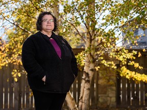 Carla Obuck with Auburn Bay Community Association poses for a photo outside her house on Tuesday, October 12, 2021.