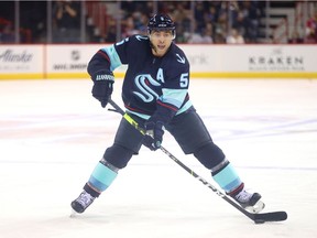 Giordano #5 of the Seattle Kraken skates with the puck in the first period against the Vancouver Canucks during a preseason game at Spokane Veterans Memorial Arena on September 26, 2021 in Spokane, Washington.