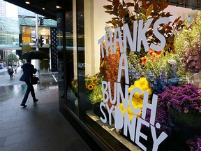 A thank-you sign is seen displayed in the David Jones CBD store window on October 11, 2021 in Sydney, Australia. COVID-19 restrictions have eased across NSW today after the state passed its 70 per cent double vaccination target.