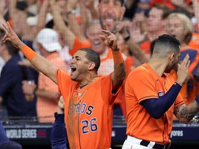 Jose Siri of the Houston Astros celebrates a home run by Jose Altuve (not pictured) against the Atlanta Braves during the seventh inning in Game 2 of the World Series at Minute Maid Park on Wednesday night in Houston.