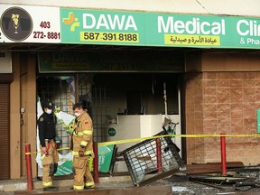 Damage is shown to the front of a medical clinic and pharmacy at a strip mall on Marlborough Dr NE Sunday, October 17, 2021.