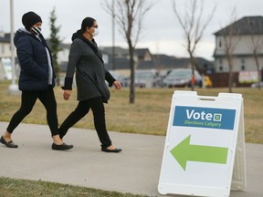 Voters leave Saddle Ridge School in northeast Calgary on Monday, October 18, 2021 after casting their ballot in Calgary's municipal election.