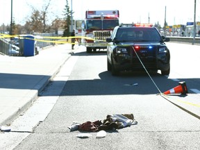 Calgary Police and emergency personnel lock down the scene of a serious stabbing at 36 St. and Marlborough Dr./8 Ave. N.E., near the Marlborough CTrain station in Calgary on Wednesday, October 27, 2021. What is believed to be the victim's clothing is seen on the pavement.