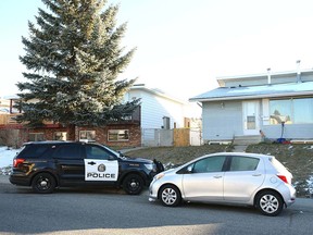 Calgary police maintain the scene on Pinehill Rd NE on Sunday, October 31, 2021 following a suspicious death on Saturday. One person is in custody.