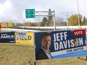 A cluster of mayor candidate signs on 17ave. near Sarcee Trail S.W. in Calgary on Monday, October 11, 2021. Darren Makowichuk/Postmedia