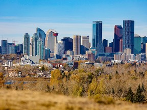 The last of the fall colours frame the downtown Calgary skyline on Tuesday, October 12, 2021.