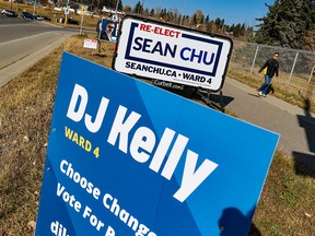 Campaign signs for Ward 4 candidates Sean Chu and DJ Kelly remained along Shaganappi Trail N.W. on Tuesday, October 19, 2021. Incumbent Chu had a very narrow victory over challenger Kelly in the municipal election on Monday night.