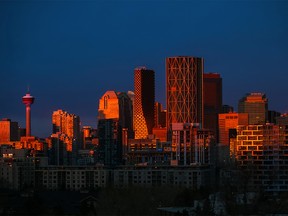 The sunrise reflects off the downtown Calgary skyline on Thursday, October 28, 2021.