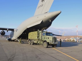 Canadian Forces equipment for Reverse Osmosis Water Purification is unloaded from a military transport aircraft, which was requested after officials in the northern territory said lab results confirmed that fuel had entered its water supply in Iqaluit, Nunavut, Canada October 23, 2021.