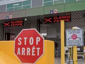 Two closed Canadian border checkpoints are seen after it was announced that the border would close to "non-essential traffic" to combat the spread of COVID-19 at the U.S.-Canada border crossing at the Thousand Islands Bridge in Lansdowne, Ont., March 19, 2020.