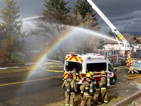 Calgary Fire battle a fully engulfed house fire at 8315 Center St. N.W. in Calgary on Sunday, October 10, 2021.