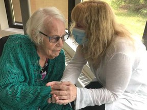 Elizabeth Hertz (right) sits with her mother Grace Ansley, who died last month at the AgeCare Midnapore long-term care home.