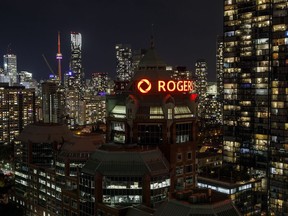 Rogers Communications Inc. logo displayed atop the the company's headquarters in Toronto, Ontario, Canada, on Sunday, Oct. 24, 2021.