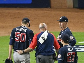 Atlanta Braves starting pitcher Charlie Morton leaves the game against the Houston Astros during the third inning during Game 1 of the 2021 World Series at Minute Maid Park.