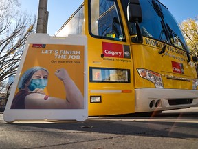 The City of Calgary's mobile COVID-19 vaccination bus was parked in front of City Hall on Thursday, Oct. 7, 2021. All city employees must be fully vaccinated against COVID-19 by Nov. 1.