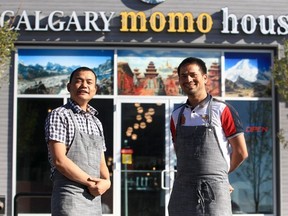 Calgary Momo House owners Gyanedra Sharma and Prakash Magar outside the restaurant. Brendan Miller/Postmedia