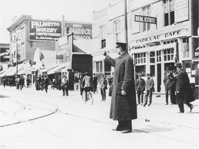 Police chief David Ritchie — seen here directing traffic before becoming Calgary's chief of police — had a stern warning for Halloween pranksters.
Photo: Courtesy, Glenbow Archives; NA-523-2.