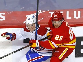 Calgary Flames forward Dillon Dube battles the Montreal Canadiens' Cole Caufield at the Scotiabank Saddledome in this photo from April 26.