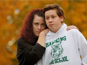 Katie Loutitt and her son Keaton Loutitt, 13, pose for a photo outside their home in St. Albert, Thursday Sept. 30, 2021. Keaton is experiencing the effects of long COVID-19. Photo by David Bloom