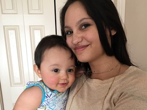 Jasmine Lovett holds her daughter, Aliyah, in an undated family photo.