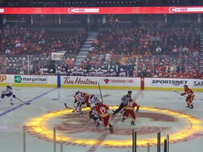 Hockey fans return to the Scotiabank Saddledome for the first time since the pandemic began for a preseason game between the Calgary Flames and Edmonton Oilers in Calgary on Sunday, Sept. 26, 2021.