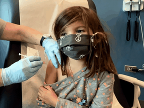 Bridgette Melo, 5, receives a reduced dose of the Pfizer BioNtech COVID-19 vaccine during a trial at Duke University in Durham, North Carolina, September 28, 2021.