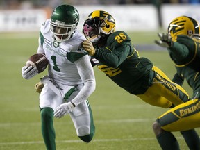 The Edmonton Eskimos’ Josh Johnson tackles the Saskatchewan Roughriders’ Shaq Evans during at Commonwealth Stadium in Edmonton Saturday on Oct. 26, 2019.