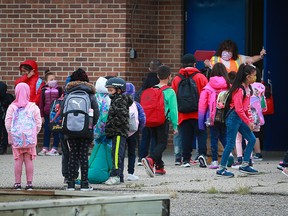 Kids head back to classes at Guy Weadick Elementary School in northeast Calgary on Wednesday, Sept. 1, 2021.