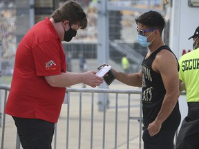 Fans attending the Toronto Argonauts versus Hamilton Tiger-Cats Labour Day Classic at Tim Horton's Field in Hamilton had to present proof of vaccination on Sept. 6, 2021.