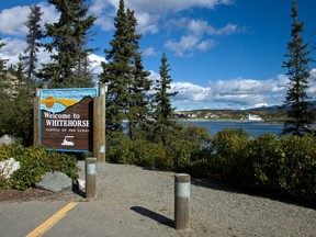 Sign along the Yukon River welcoming visitors to Whitehorse, Yukon.