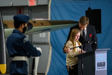 Gracie Dejardins, Hangar Flight Museum executive director Brian Desjardins’s daughter, is overcome with tears as she gives a speech at the Remembrance Day ceremony at the museum on Thursday, November 11, 2021. Azin Ghaffari/Postmedia