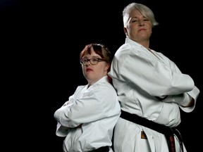 Natalie Olson, left, was the first Canadian with Down syndrome to achieve her black belt in karate. Now, she's training for her next big challenge with her coach and friend of over 20 years, Sensei Heather Fidyk, right. From the Calgary-shot film Sensei. Photo courtesy, Sean Smith.