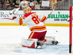 Calgary Flames goaltender Daniel Vladar warms up before a game against the Boston Bruins at TD Garden in Boston on Sunday, Nov. 21, 2021.