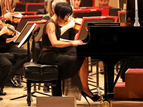 Pianist Yuja Wang performs with the Philadelphia Orchestra during opening night at Carnegie Hall on Oct. 6, 2021, in New York City. Carnegie Hall was holding its first performance of the 2021-2022 season - the first in 18 months since closing due to the coronavirus pandemic.
