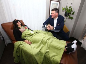 Dr. Robert Tanguay demonstrates a treatment in  a one-on-one assisted treatment room at the Newly Institute in Calgary. A patient would typically spend two hours in the room.