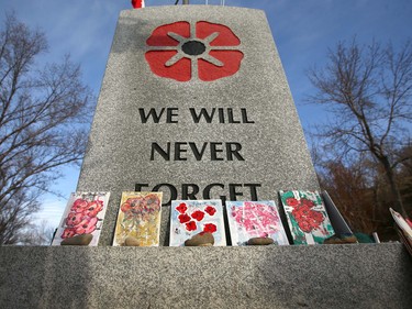 A monument is decorated with hand drawn artwork During Remembrance Day ceremonies at the Field of Crosses on Memorial Drive in northwest Calgary on Thursday, November 11, 2021. Jim Wells/Postmedia