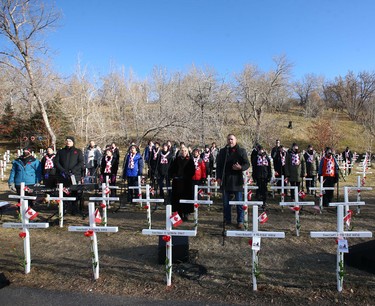 Canadian singer George Canyon (R) sings the National Anthem and is joined by a choir during Remembrance Day ceremonies at the Field of Crosses on Memorial Drive in northwest Calgary on Thursday, November 11, 2021. Jim Wells/Postmedia