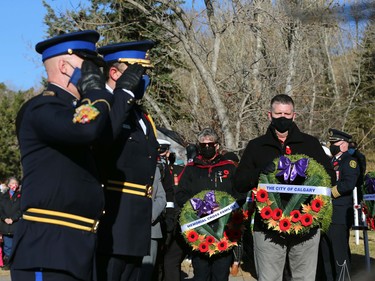 A representative from the City of Calgary lays a wreath during Remembrance Day ceremonies at the Field of Crosses on Memorial Drive in northwest Calgary on Thursday, November 11, 2021. Jim Wells/Postmedia